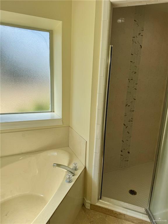 2207 Turtle Court Mission, TX 78572 - Photo 18 of 22 a bathroom with a tub and shower