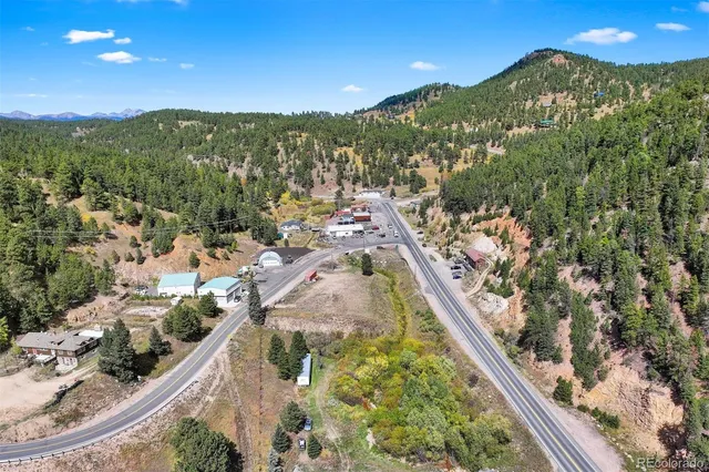 a view of a town with mountains in the background