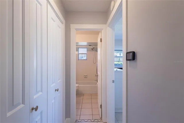 a bathroom with a glass shower door