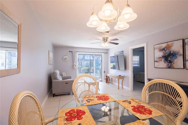 a living room with furniture chandelier and couch