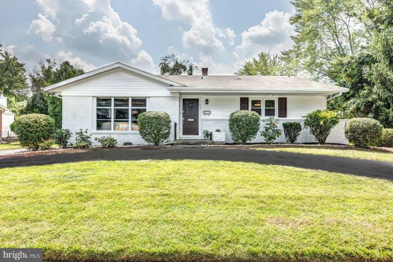 4537 Maryknoll Road Baltimore, MD 21208 - Photo 2 of 30 a front view of a house with swimming pool and glass windows