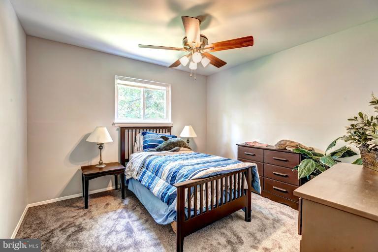 4537 Maryknoll Road Baltimore, MD 21208 - Photo 24 of 30 a bedroom with a bed window and a table