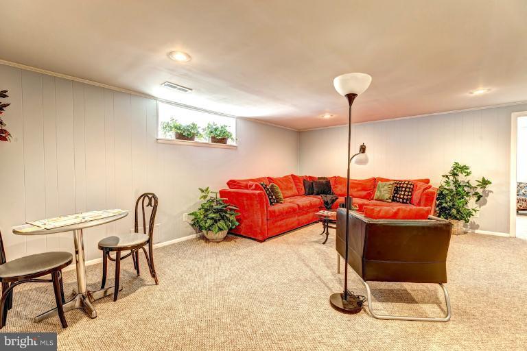 4537 Maryknoll Road Baltimore, MD 21208 - Photo 25 of 30 a living room with furniture a rug and a lamp