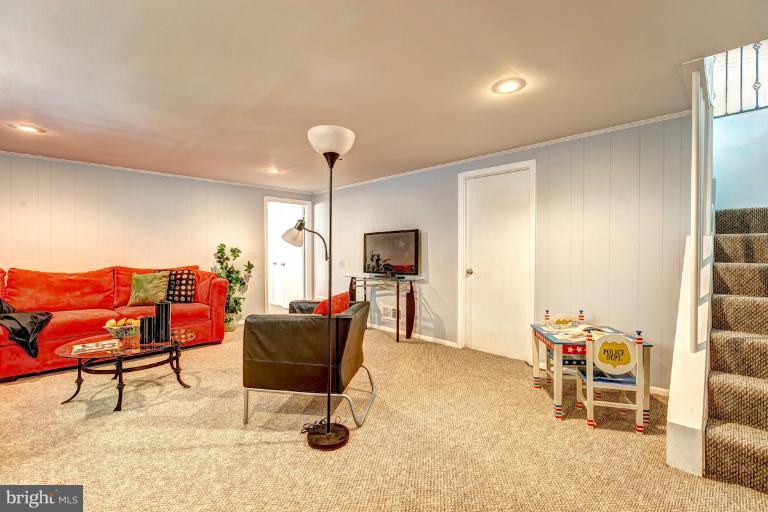 4537 Maryknoll Road Baltimore, MD 21208 - Photo 26 of 30 a living room with furniture and a flat screen tv