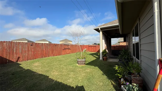 a view of a back yard of the house