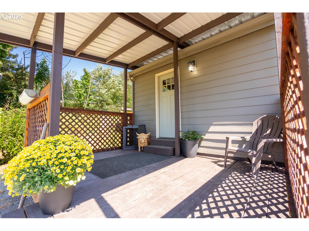 165 8th Place Mill City, OR 97360 - Photo 17 of 39 a balcony view with a couch and wooden floor