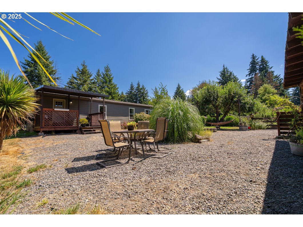 165 8th Place Mill City, OR 97360 - Photo 20 of 39 a view of a outdoor space with a table and chairs under an umbrella