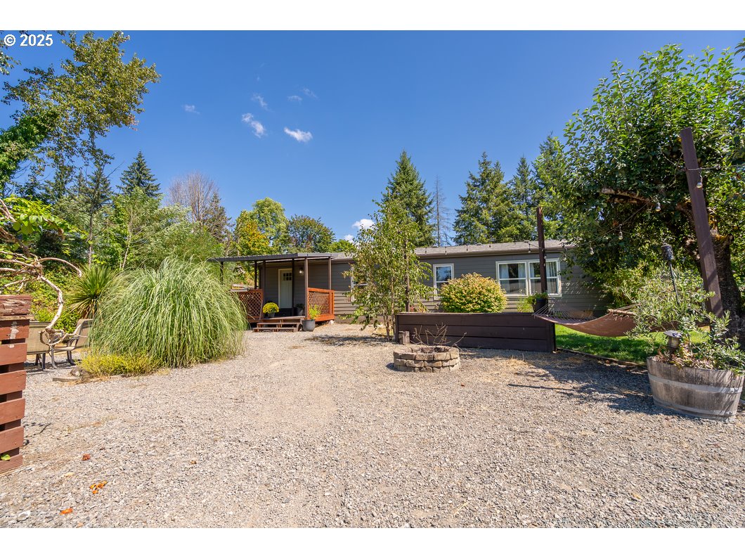 165 8th Place Mill City, OR 97360 - Photo 24 of 39 a view of a house with backyard and sitting area