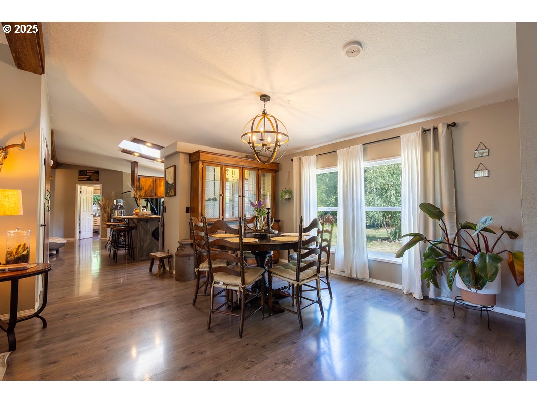 165 8th Place Mill City, OR 97360 - Photo 3 of 39 a view of a dining room with furniture window and wooden floor