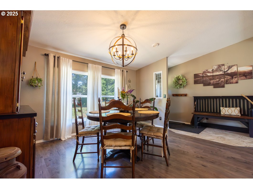 165 8th Place Mill City, OR 97360 - Photo 4 of 39 a view of a dining room with furniture window and wooden floor