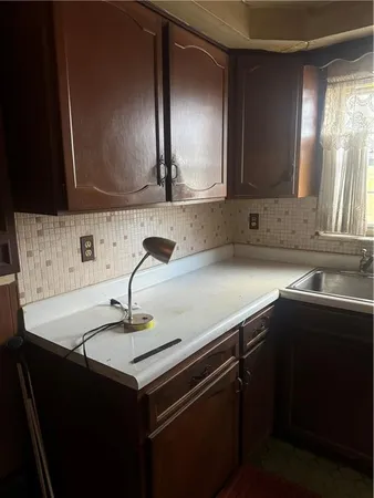 a kitchen with a sink and a cabinets