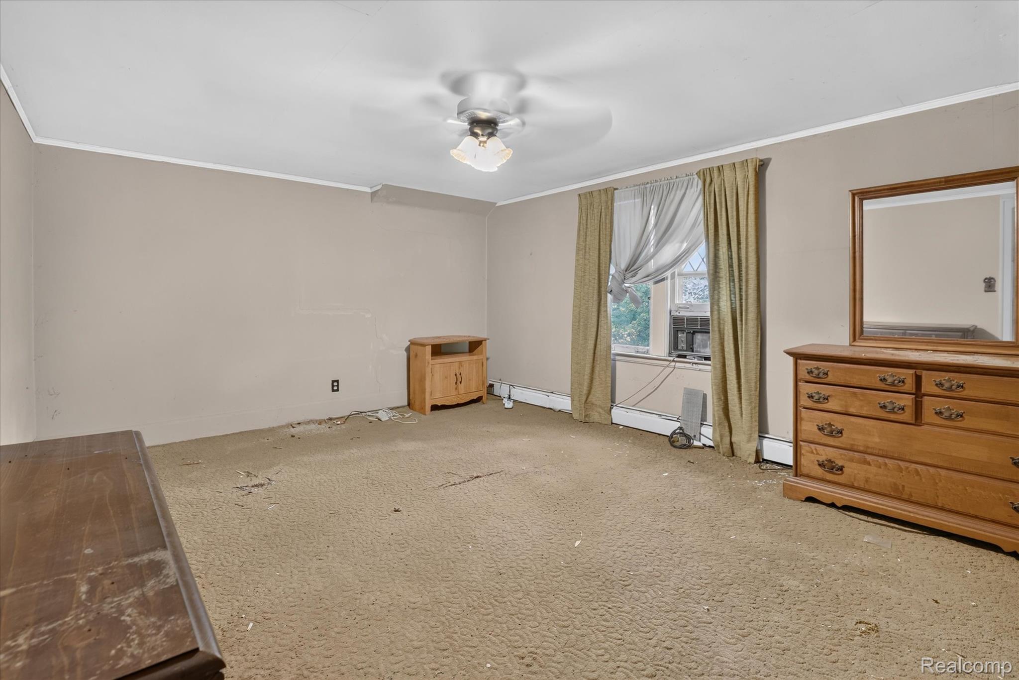 26275 Pennsylvania Road Romulus, MI 48174 - Photo 12 of 23 Carpeted room with neutral painted walls and a ceiling fan