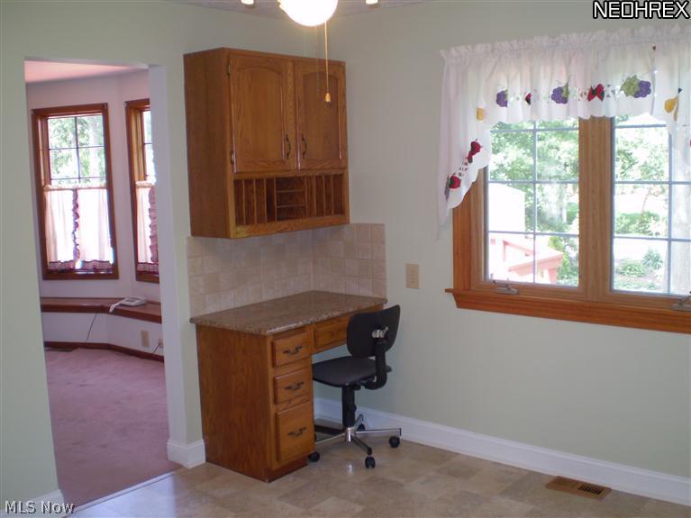 30509 Ridge Road Wickliffe, OH 44092 - Photo 12 of 24 Kitchen has completely redone. Even the kitchen desk has a beautiful granite top