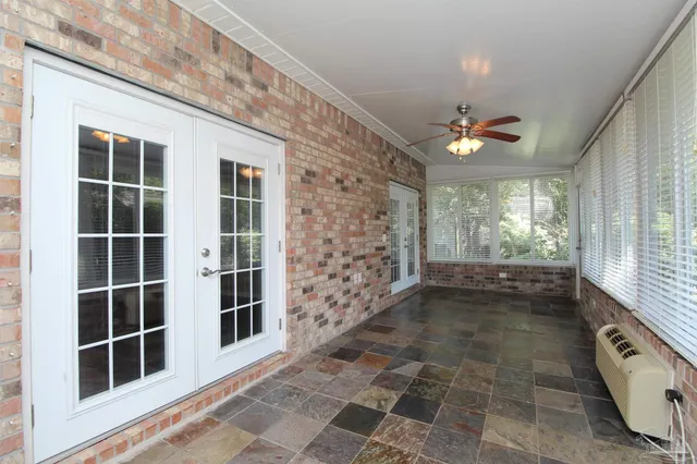 a view of a hallway with windows