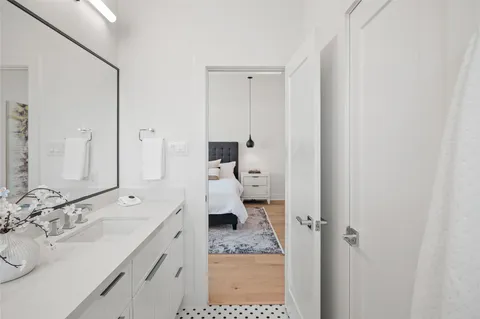 a bedroom with a bed and a chair