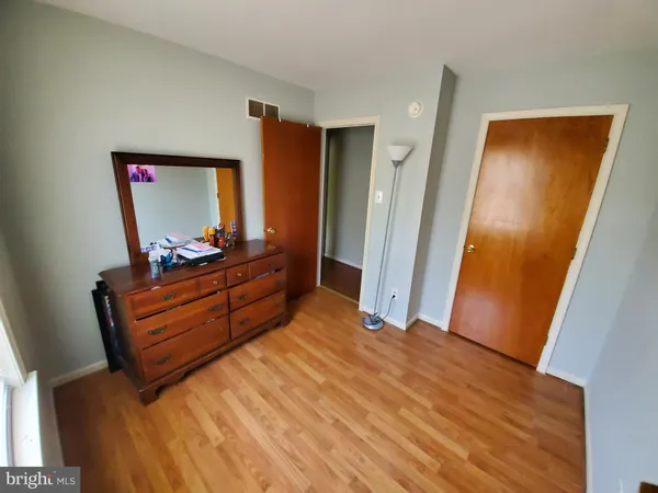 a bed room with a bed and a mirror