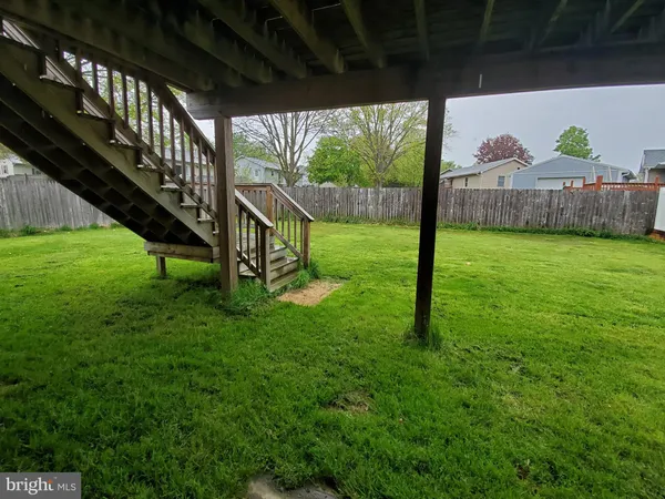 a view of a house with a backyard porch and sitting area