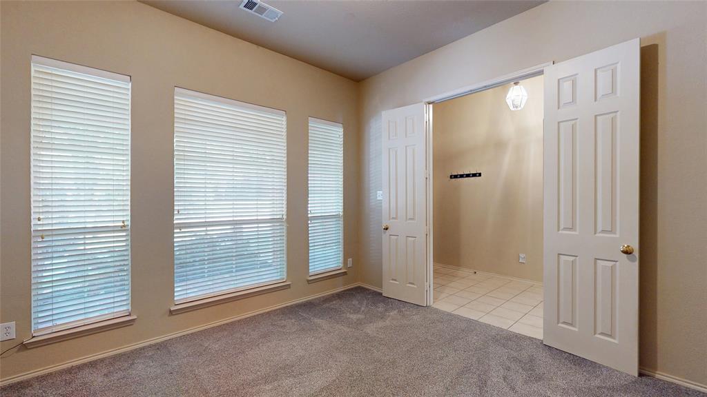 1910 Wickersham Lane Corinth, TX 76210 - Photo 14 of 38 a view of an empty room with a window