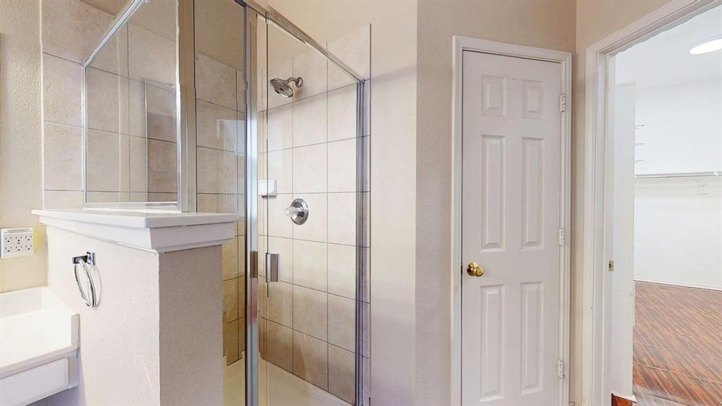 1910 Wickersham Lane Corinth, TX 76210 - Photo 20 of 38 a bathroom with a shower