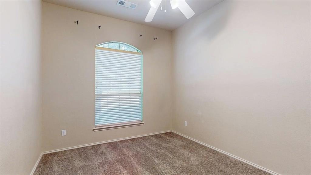 1910 Wickersham Lane Corinth, TX 76210 - Photo 31 of 38 a view of an empty room with a window