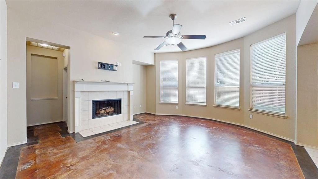 1910 Wickersham Lane Corinth, TX 76210 - Photo 7 of 38 a view of an empty room with exposed radiator and fireplace