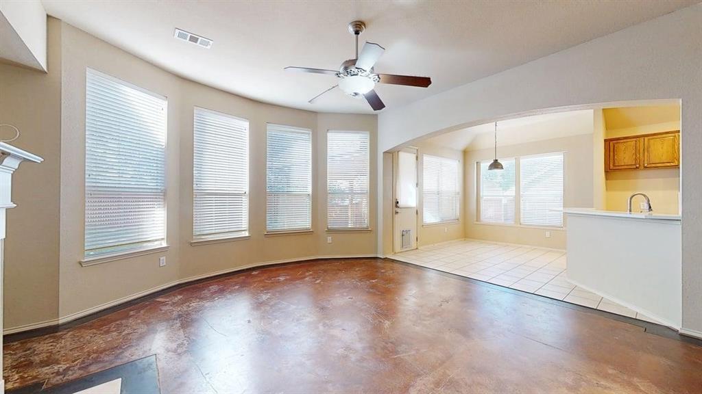1910 Wickersham Lane Corinth, TX 76210 - Photo 10 of 38 a view of an empty room with a window and wooden floor