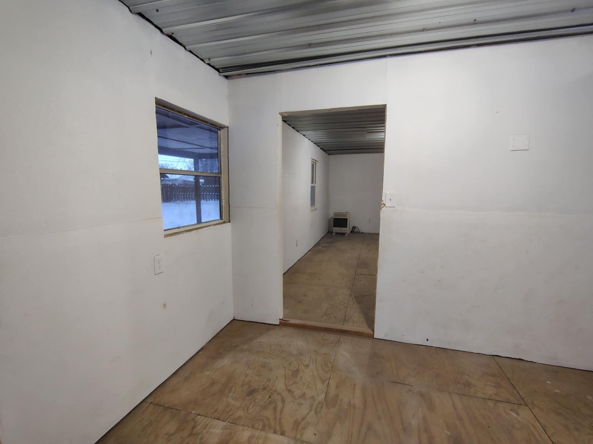23809 Shelby Road Lowell, IN 46356 - Photo 15 of 19 a view of a hallway with wooden floor and a window