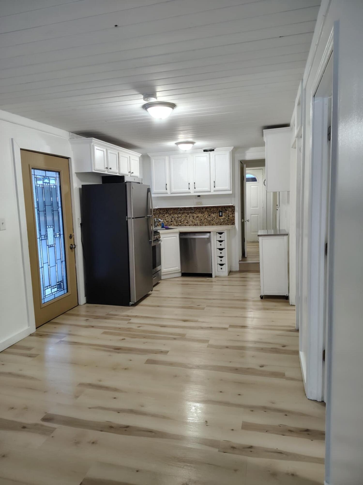 23809 Shelby Road Lowell, IN 46356 - Photo 3 of 19 a view of a kitchen with a refrigerator and a sink