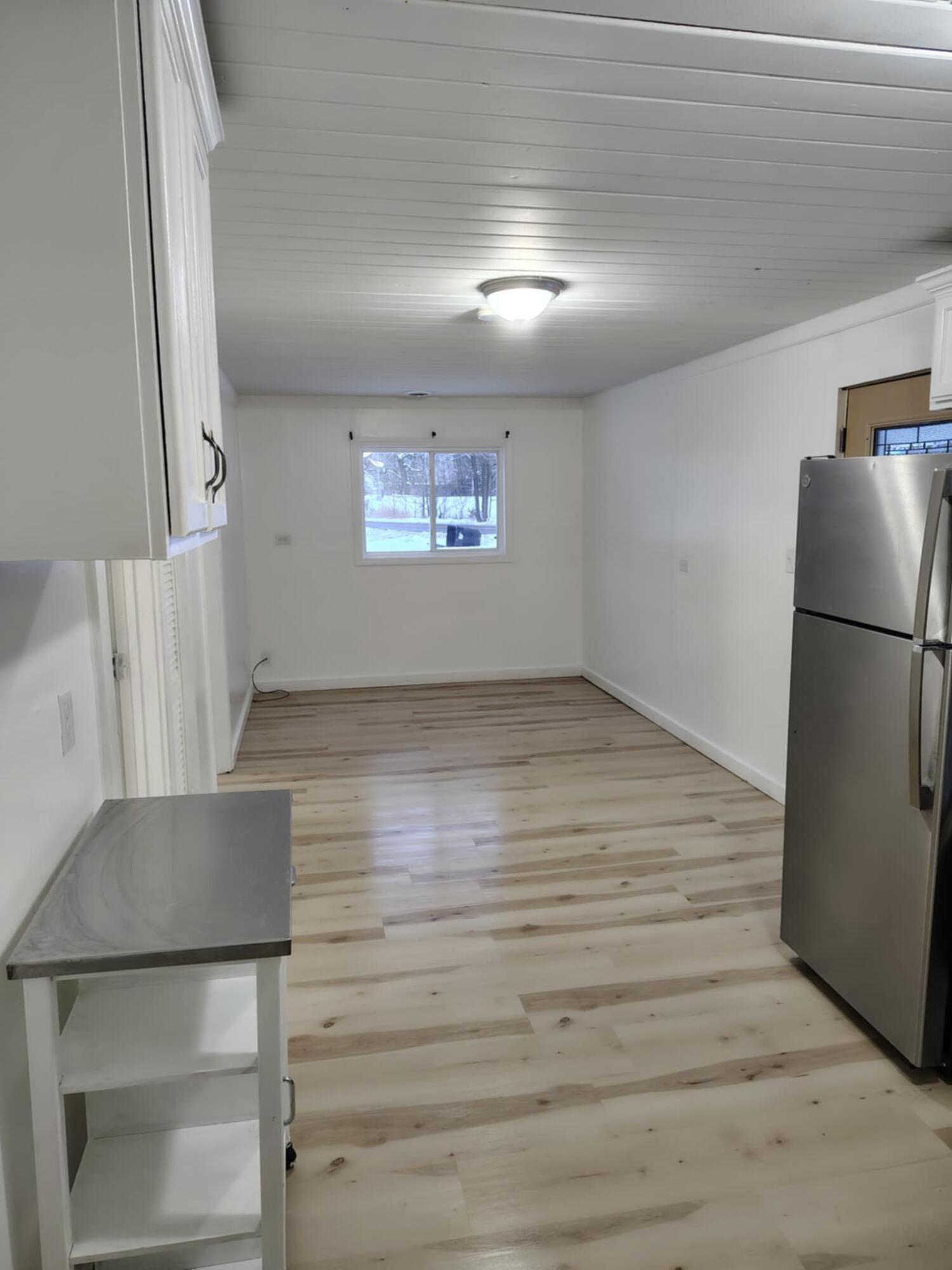 23809 Shelby Road Lowell, IN 46356 - Photo 5 of 19 a view of kitchen and hallway with a microwave