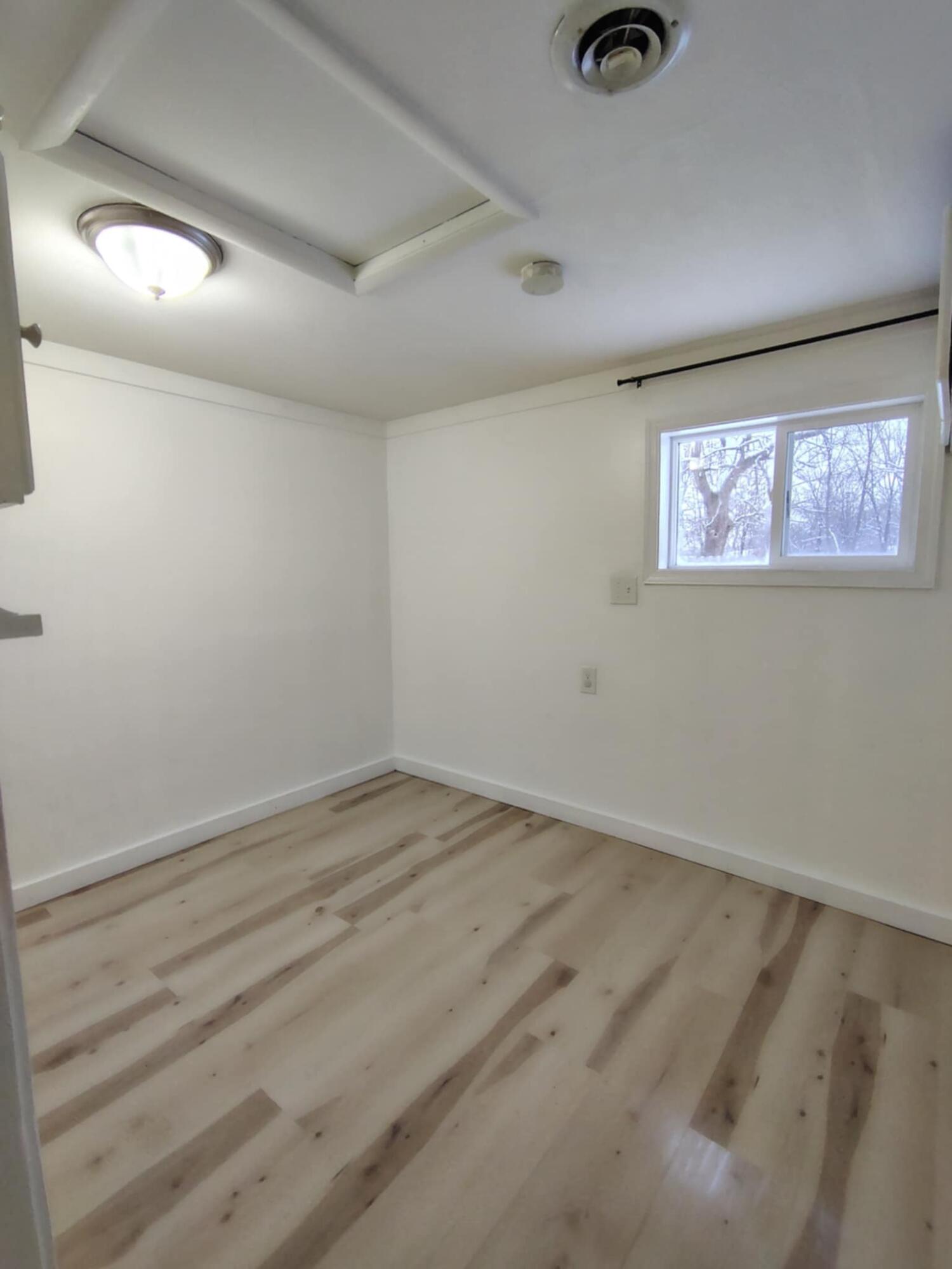 23809 Shelby Road Lowell, IN 46356 - Photo 8 of 19 an empty room with a window