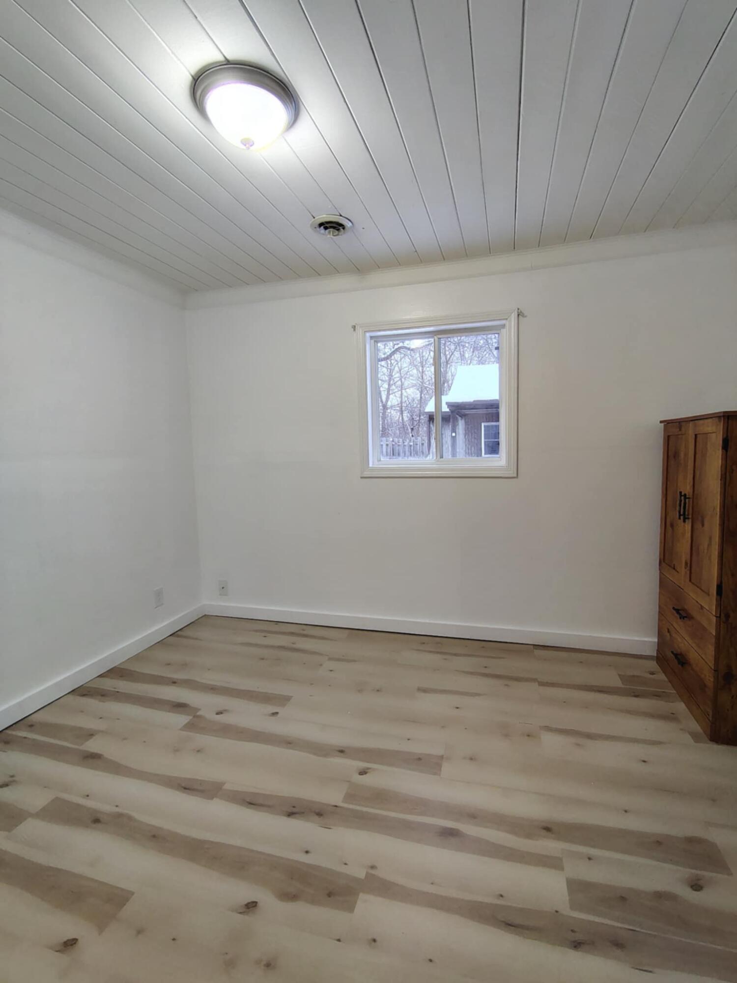 23809 Shelby Road Lowell, IN 46356 - Photo 9 of 19 a view of empty room with wooden floor
