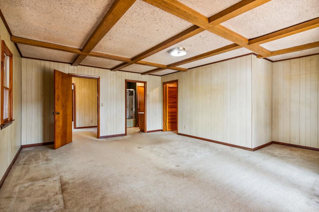 855 Lickskillet Road Epworth, GA 30541 - Photo 20 of 35 a view of empty room with wooden walls