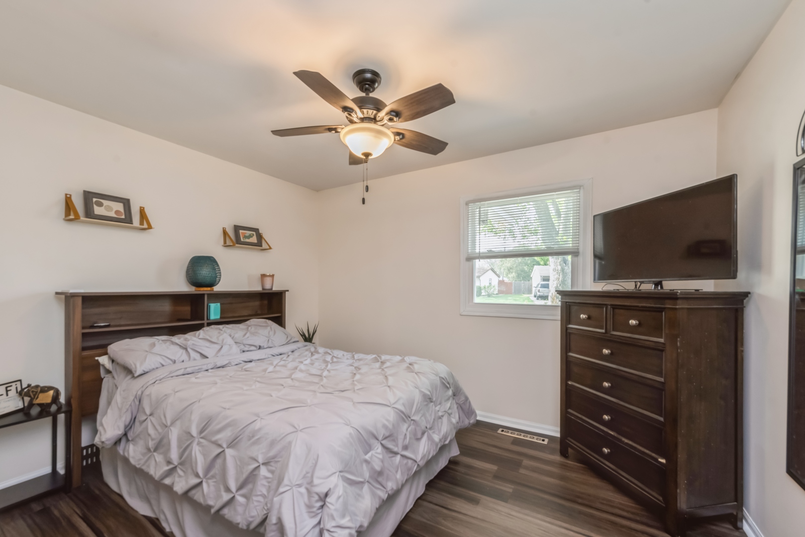 318 Dunbar Road Wauconda, IL 60084 - Photo 11 of 15 a bedroom with a bed and a flat tv screen on dresser
