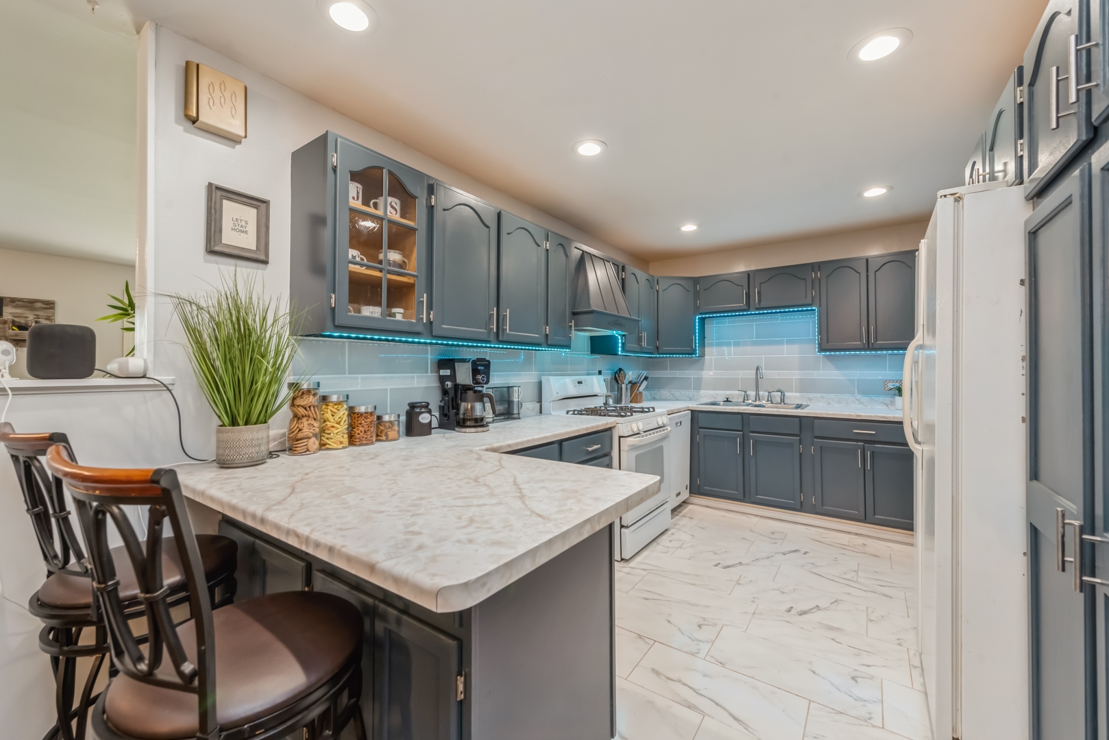318 Dunbar Road Wauconda, IL 60084 - Photo 4 of 15 a kitchen with a table chairs sink and cabinets