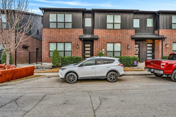 a car parked in front of a house
