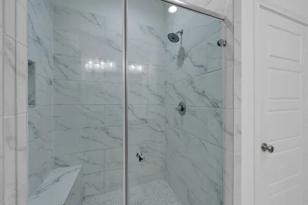 a bathroom with a sink double vanity and a shower