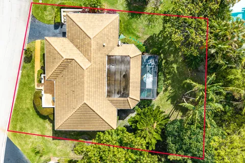 an aerial view of a house with swimming pool