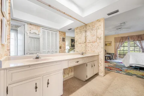 a bathroom with a shower and a sink