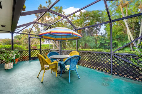 a view of an chairs and table in the patio