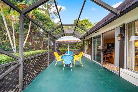 a view of an chairs and table in the patio