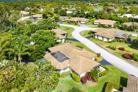an aerial view of residential house with outdoor space and swimming pool