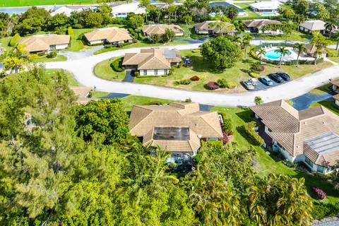 an aerial view of a house with swimming pool