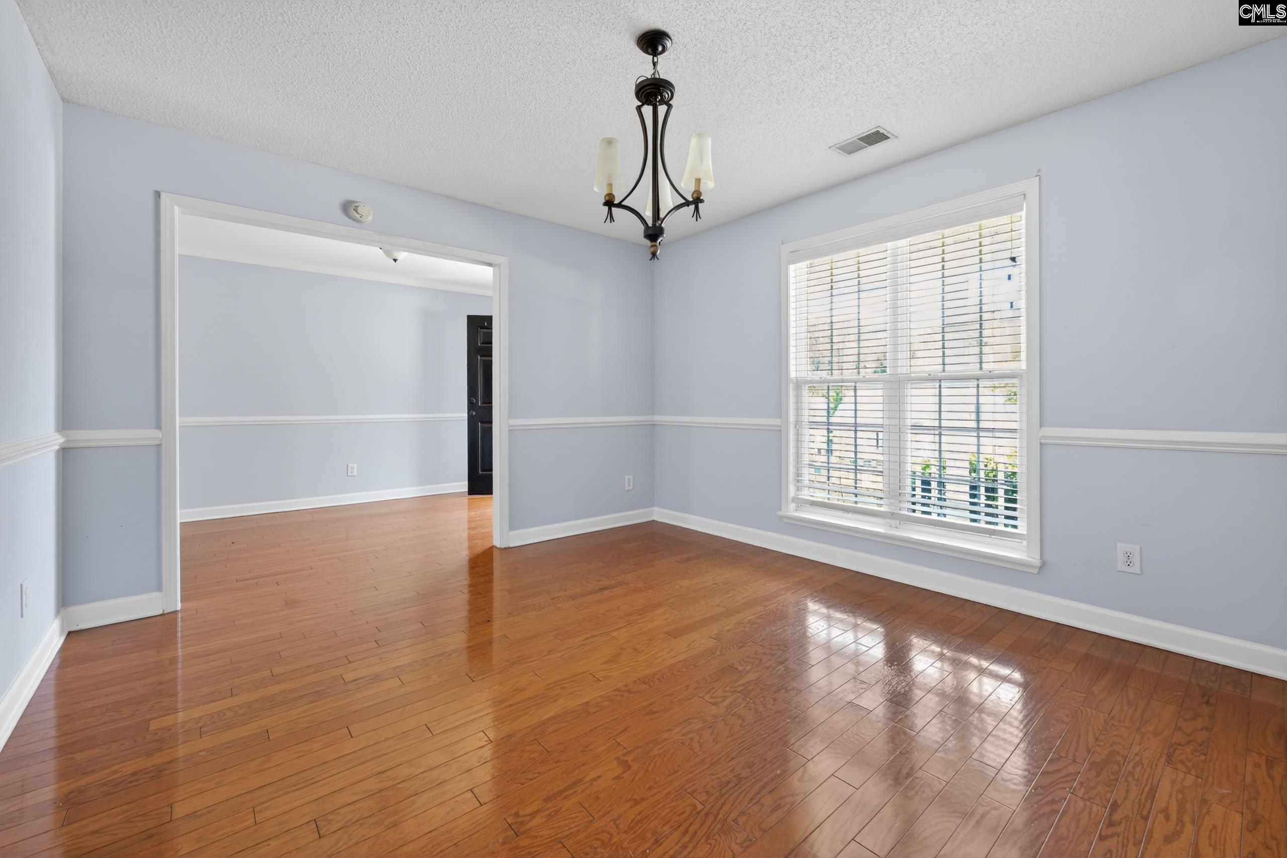 219 Plantation Pointe Drive Elgin, SC 29045 - Photo 29 of 56 a view of an empty room with window and wooden floor