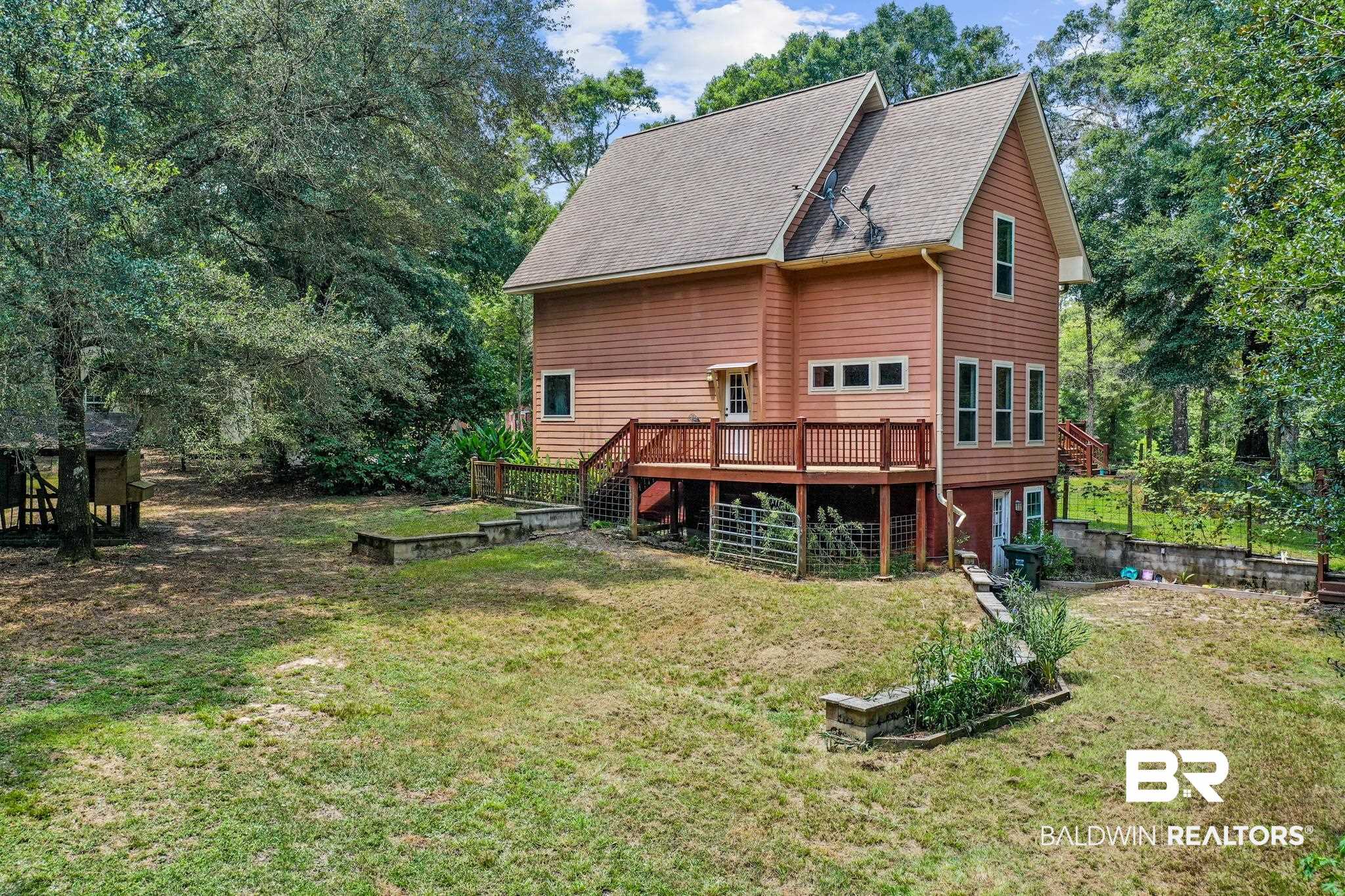 8321 Dixon Road Bay Minette, AL 36507 - Photo 79 of 79 Rear view of property featuring a yard and a deck