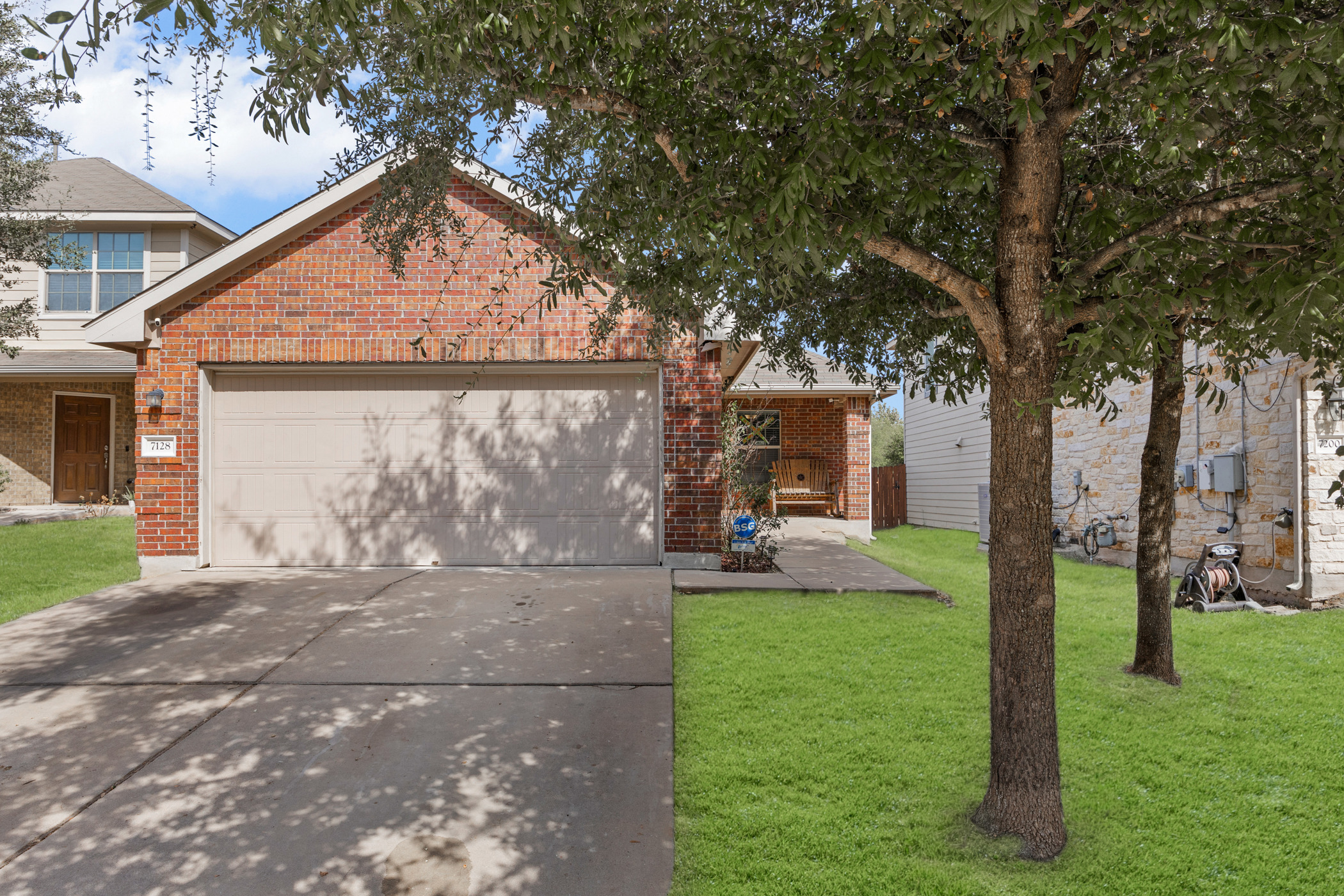 a front view of a house with garden