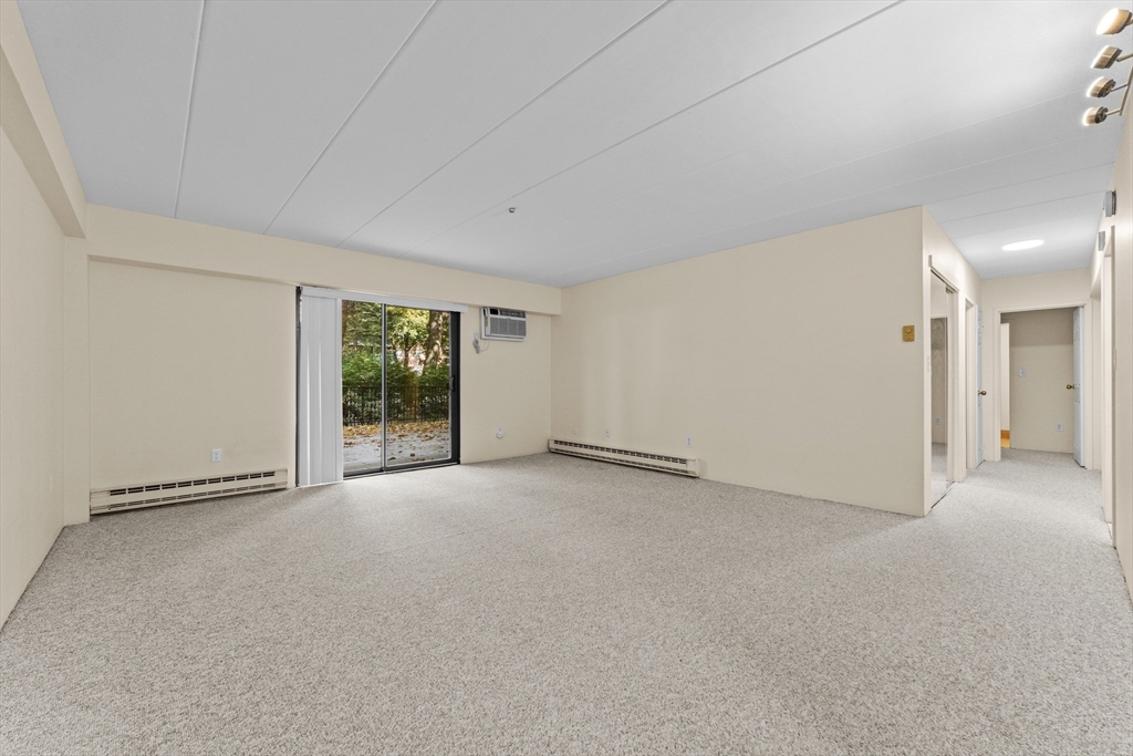 135 Pleasant Street, Unit 106 Brookline, MA 02446 - Photo 14 of 27 a view of an empty room with window