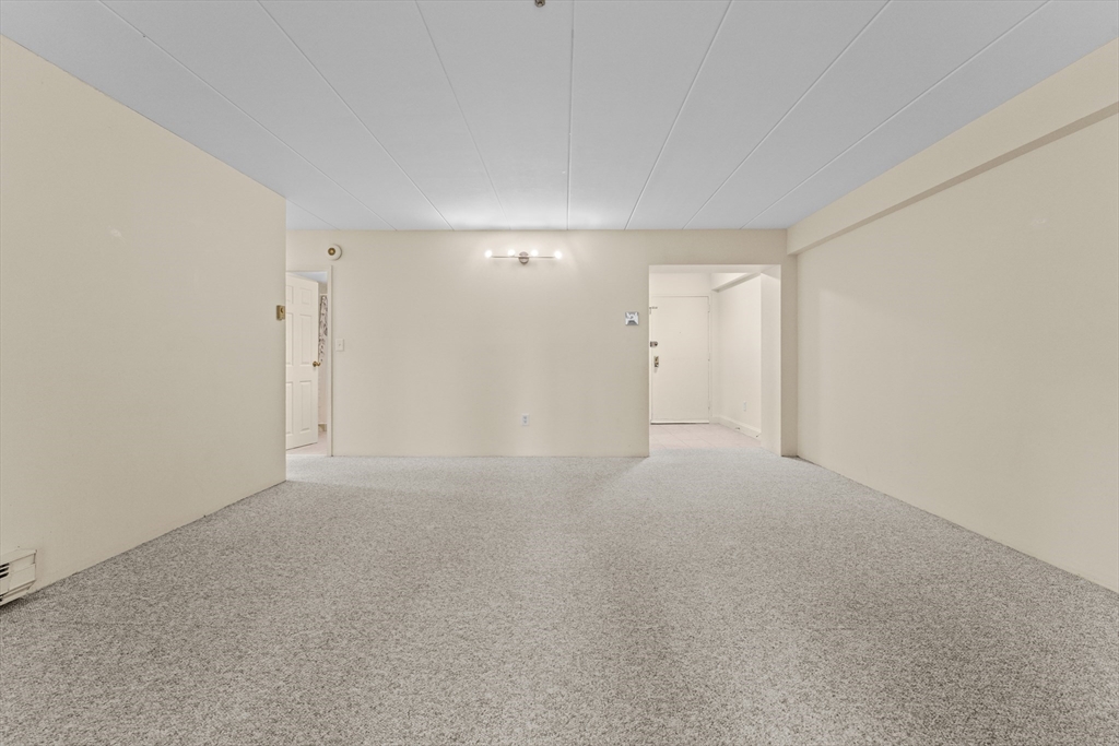 135 Pleasant Street, Unit 106 Brookline, MA 02446 - Photo 15 of 27 a view of empty room