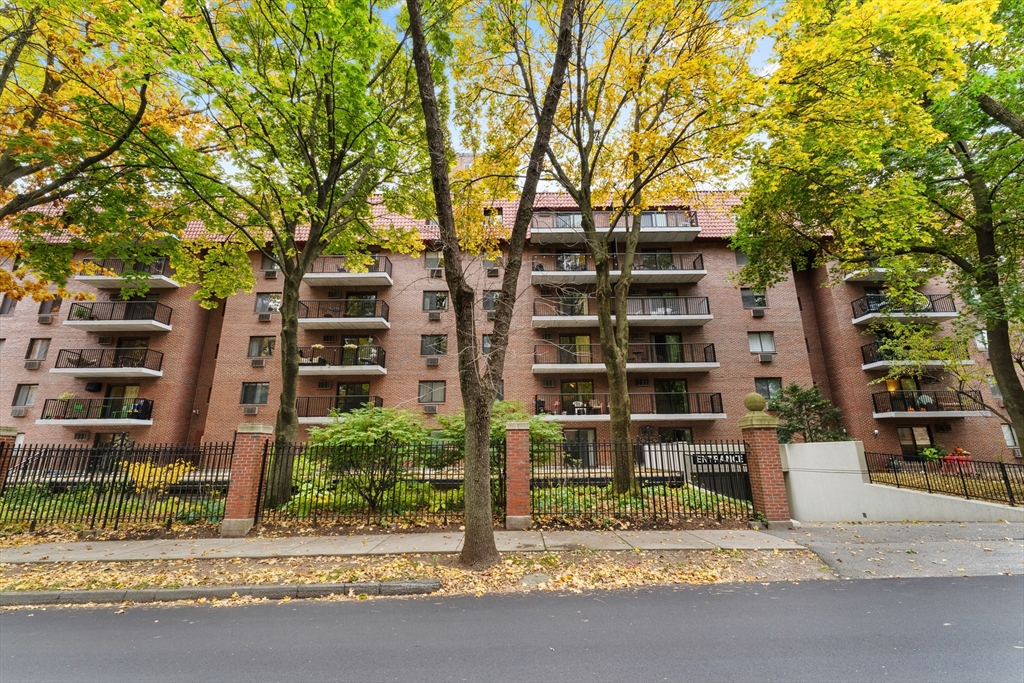 135 Pleasant Street, Unit 106 Brookline, MA 02446 - Photo 2 of 27 front view of a building with street view