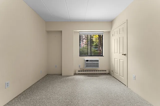 a bathroom with a toilet sink and shower