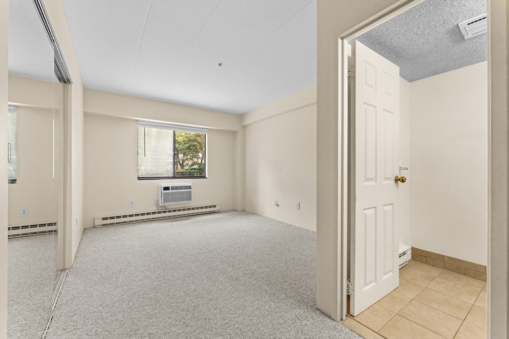 135 Pleasant Street, Unit 106 Brookline, MA 02446 - Photo 24 of 27 a view of an empty room